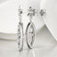 Aretes colgantes con forma de flor y diamantes redondos de 0,52 quilates en oro blanco de 18 quilates
