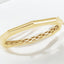 Brazalete tipo brazalete con bisagras geométricas en oro amarillo de 14 kt