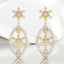 Aretes colgantes con forma de flor y diamantes redondos de 0,52 quilates en oro amarillo de 18 quilates