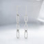 Aretes colgantes con clip de diamantes cultivados en laboratorio redondos de 0,26 quilates en oro blanco de 14 quilates