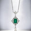 Emerald Cut Emerald and Diamond Pendant in Platinum