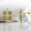 Aretes de peridoto y trébol de diamantes en oro amarillo de 14 kt