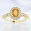 Anillo con halo de diamantes y citrino ovalado en oro amarillo de 14 kt