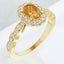 Anillo con halo de diamantes y citrino ovalado en oro amarillo de 14 kt