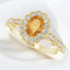 Anillo con halo de diamantes y citrino ovalado en oro amarillo de 14 kt