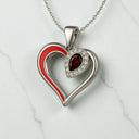 Pear Shaped Garnet and Lab Grown Diamond Heart Pendant in 925 Sterling Silver
