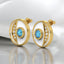 Round Blue Topaz and Lab Grown Diamond Stud Earrings in 18kt Yellow Gold Plated 925 Sterling Silver