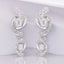 1.23 ctw Round and Emerald Cut Lab Grown Diamond Earrings