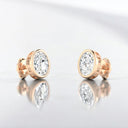 Bezel Set Oval Lab Grown Diamond Stud Earrings in 14kt Rose Gold